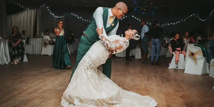 Groom dipping the bride during their first dance